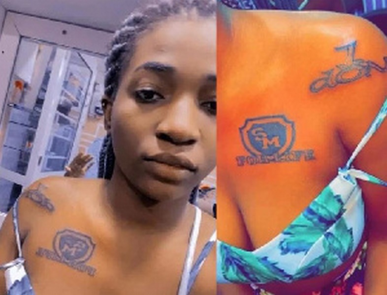 A photo of the lady who has tattooed Shatta Wale's name on her breast