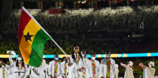 TOKYO, JAPAN - JULY 23: Flag bearers Nadia Eke and Sulemanu Tetteh of Team Ghana lead their team during the Opening Ceremony of the Tokyo 2020 Olympic Games at Olympic Stadium on July 23, 2021 in Tokyo, Japan. (Photo by Matthias Hangst/Getty Images)