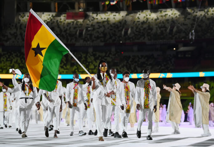 TOKYO, JAPAN - JULY 23: Flag bearers Nadia Eke and Sulemanu Tetteh of Team Ghana lead their team during the Opening Ceremony of the Tokyo 2020 Olympic Games at Olympic Stadium on July 23, 2021 in Tokyo, Japan. (Photo by Matthias Hangst/Getty Images)