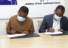 CEO of Africa Health Holdings Sangu Delle [in brown] and Dr Maxwell Antwi Country Director of PharmAccess [in blue]