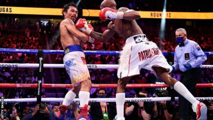 Manny Pacquiao (left) last fought in July 2019