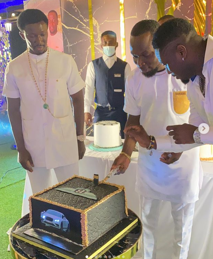 Asamoah Gyan and Nana Kwame Bediako cut the birthday cake with celebrant KJB 