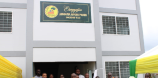 • Some officials in front of the accommodation facility for the medical officers