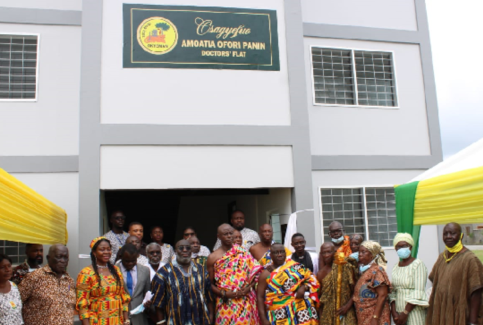 • Some officials in front of the accommodation facility for the medical officers