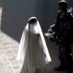 Kanye West joined by wedding dress-wearing Kim Kardashian at Donda launch event