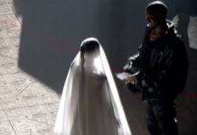 Kanye West joined by wedding dress-wearing Kim Kardashian at Donda launch event