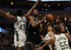 Reigning champions Milwaukee Bucks started their title defence with victory over Brooklyn Nets