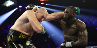 LAS VEGAS, NEVADA - FEBRUARY 22: Deontay Wilder punches Tyson Fury during their Heavyweight bout for Wilder's WBC and Fury's lineal heavyweight title on February 22, 2020 at MGM Grand Garden Arena in Las Vegas, Nevada. (Photo by Al Bello/Getty Images)