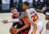 Miami Heat forward Micah Potter (L) in action against Atlanta Hawks forward John Collins (R) during the first half of the preseason NBA basketball game between the Miami Heat and the Atlanta Hawks at State Farm Arena in Atlanta, Georgia, USA, 14 October 2021. EPA/ERIK S. LESSER SHUTTERSTOCK OUT