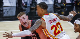 Miami Heat forward Micah Potter (L) in action against Atlanta Hawks forward John Collins (R) during the first half of the preseason NBA basketball game between the Miami Heat and the Atlanta Hawks at State Farm Arena in Atlanta, Georgia, USA, 14 October 2021. EPA/ERIK S. LESSER SHUTTERSTOCK OUT