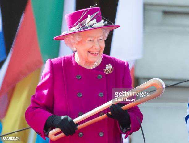 LONDON, ENGLAND - MARCH 13: Queen Elizabeth II holds the Commonwealth baton during the launch of The Queen's Baton Relay for the XXI Commonwealth Games being held on the Gold Coast in 2018 at Buckingham Palace on March 13, 2017 in London, England. (Photo by Samir Hussein/Samir Hussein/WireImage)