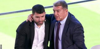 Aguero was consoled by Barcelona president Joan Laporta during the news conference