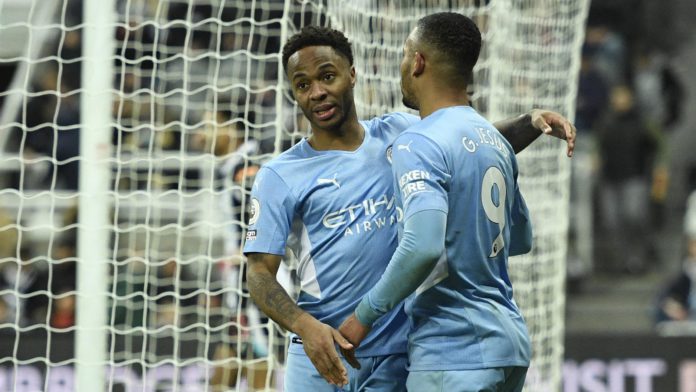 Manchester City's English midfielder Raheem Sterling (L) celebrates with Manchester City's Brazilian striker Gabriel Jesus (R) after scoring their fourth goal during the English Premier League football match between Newcastle United and Manchester City Image credit: Getty Images