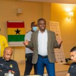 Sports Minister speaking to Black Stars players