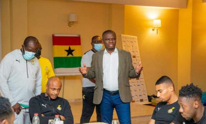 Sports Minister speaking to Black Stars players