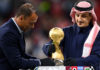AL KHOR, QATAR - DECEMBER 18: Former Saudi Arabian International Player, Nawaf Al-Temyat (R) and Former Brazilian World Cup Winner, Cafu (L) place the FIFA Arab Cup Trophy on a plinth on pitch following the FIFA Arab Cup Qatar 2021 Final match between Tunisia and Algeria at Al Bayt Stadium on December 18, 2021 in Al Khor, Qatar. (Photo by Michael Regan - FIFA/FIFA via Getty Images)