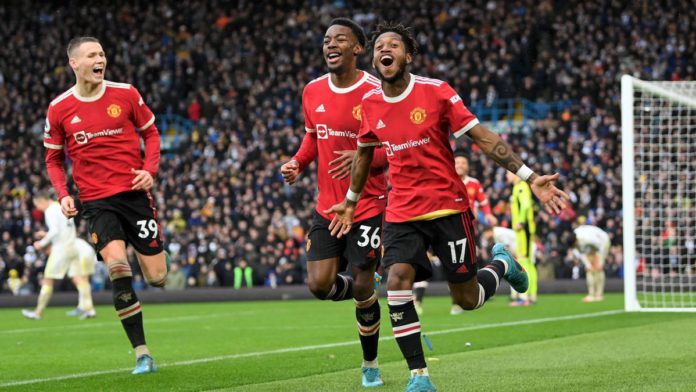 Fred celebrates with Anthony Elanga and Scott McTominay of Manchester United after scoring their team's third goal during the Premier League match between Leeds United and Manchester United at Elland Road on February 20, 2022 Image credit: Getty Images