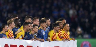 Barcelona and Napoli players hold banner