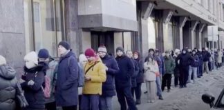 People in Russia queued for several hours to take out their money ( Image: Sky News)