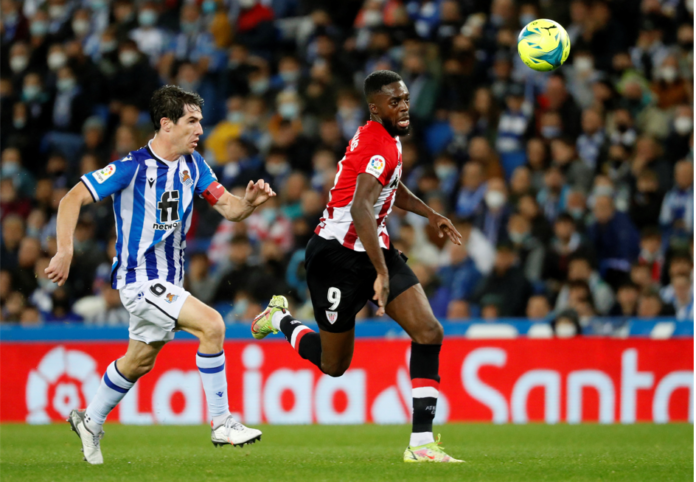 Real Sociedad's defender Aritz Elustondo (L) in action against Athletic Bilbao's striker Inaki Williams (R) during the Spanish LaLiga soccer match between Real Sociedad and Athletic Club Bilbao held at Reale Arena stadium, in San Sebastian, northern Spain, 31 October 2021. EPA/Juan Herrero