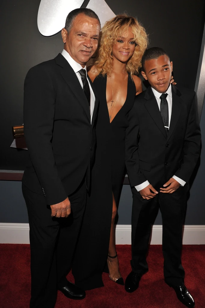 Ronald Fenty (left), singer Rihanna and her little brother, Rajad, arrive at the Grammys in 2012 in LA. After a long dispute, Rihanna and Ronald appear to be on speaking terms again.
