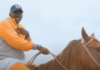 Medikal rides a horse in his "Ghost" music video