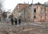 Ukrainian police officers patrol a street following shelling in Ukraine's second-biggest city of Kharkiv (Image: AFP via Getty Images)