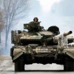 Russia ‘could swap Ukrainian steel plant siege heroes with imprisoned officers’ Ukrainian servicemen ride on tanks toward the front line with Russian forces in the Luhansk region of Ukraine on Friday. The president has waived entry visa requirements for any foreigners who want to join the fight against Russia. (Anatolii Stepanov/AFP via Getty Images)