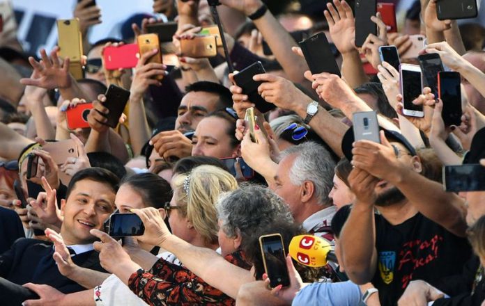 Supporters crowded around Mr. Zelensky as he arrived at parliament in Kyiv for a swearing-in ceremony in 2019. PHOTO: SERGEI SUPINSKY/AGENCE FRANCE-PRESSE/GETTY IMAGES