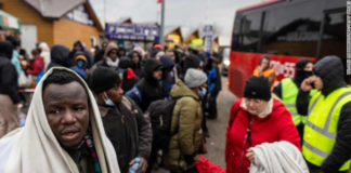 People fleeing the violence in Ukraine are seen at the Medyka pedestrian border crossing in eastern Poland on February 27, 2022. | Credit: Wojtek Radwanski/AFP/Getty Images