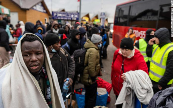 People fleeing the violence in Ukraine are seen at the Medyka pedestrian border crossing in eastern Poland on February 27, 2022. | Credit: Wojtek Radwanski/AFP/Getty Images