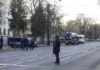 Police officers stand guard of the crime scene in Bucharest, Romania, outside the Russian embassy ( Image: REUTERS)