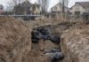 Bodies of civilians are seen in mass graves in Bucha ( Image: Anadolu Agency via Getty Images)