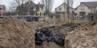 Bodies of civilians are seen in mass graves in Bucha ( Image: Anadolu Agency via Getty Images)