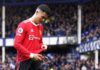 Ronaldo appeared to knock a young fan's phone to the ground as he walked down the tunnel at Goodison