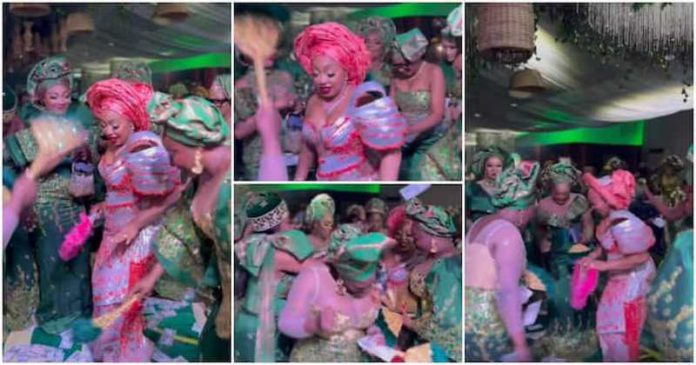 Nollywood actresses making it rain cash at Rita Dominic's wedding. Photos: @chiomaakpotha