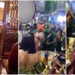 Singer Kcee sprays money on actress Rita Dominic. Photo: @iam_ikeonyema