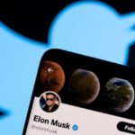 Elon Musk's twitter account is seen on a smartphone in front of the Twitter logo in this photo illustration taken, April 15, 2022. REUTERS/Dado Ruvic/Illustration/File Photo