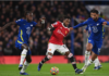 Manchester United's Fred (C) in action against Chelsea players Trevoh Chalobah (L) and Ruben Loftus-Cheek (R)