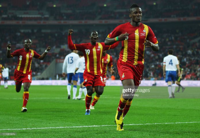 LONDON, ENGLAND - MARCH 29: Asamoah Gyan (R) of Ghana celebrates after he scores the equalising goal during the international friendly match between England and Ghana at Wembley Stadium on March 29, 2011 in London, England. (Photo by Julian Finney/Getty Images)