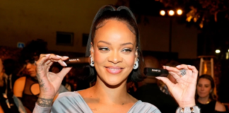 Rihanna poses with engraved Fenty Beauty ICON Lipsticks as she celebrates the launch of Fenty Beauty at ULTA Beauty on March 12, 2022 in Los Angeles, California. Kevin Mazur/GI for Fenty Beauty by Rihanna