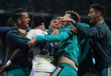 MADRID, SPAIN - MAY 04: Vinicius Junior of Real Madrid celebrates with team mates after Rodrygo of Real Madrid (not pictured) scores their sides second goal during the UEFA Champions League Semi Final Leg Two match between Real Madrid and Manchester City Image credit: Getty Images