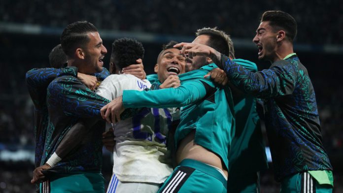 MADRID, SPAIN - MAY 04: Vinicius Junior of Real Madrid celebrates with team mates after Rodrygo of Real Madrid (not pictured) scores their sides second goal during the UEFA Champions League Semi Final Leg Two match between Real Madrid and Manchester City Image credit: Getty Images