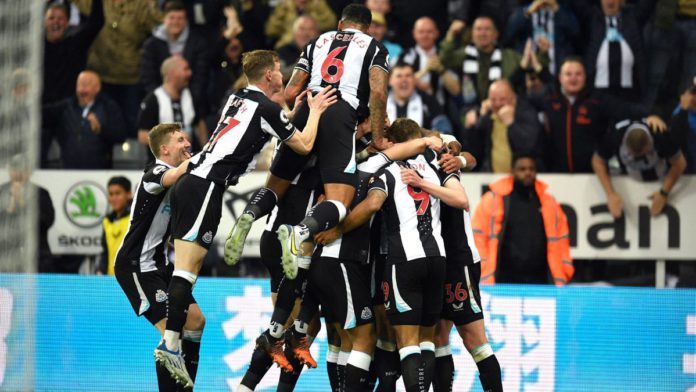 Callum Wilson is mobbed by teammates after Ben White's own goal hands Newcastle the lead over Arsenal Image credit: Getty Images