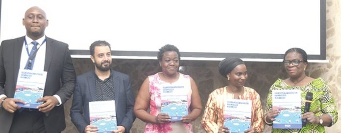 From left: Nnamdi Iwuora, Senior Programme Manager of IOM; David Shokry, Resource Management Officer of IOM; Myra Togobo, Officer in charge of Data Management, Evaluation and Registration at the Office of the United Nations Resident Coordinator; Abibatou Wane, the IOM’s Chief of Mission for Ghana, Benin and Togo, and Adelaide Anno-Kumi, Chief Director of the Ministry of the Interior, diplaying the IOM Ghana Country Strategy for 2022 to 2025 at the launch in Accra