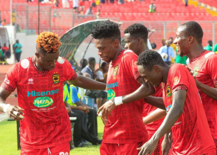 Etouga celebrates with Asante Kotoko teammates