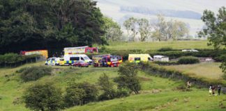 Emergency services by Bentham Road near Burton in Lonsdale, where a helicopter has crashed into a field (Image: Ben Lack Photography Ltd)