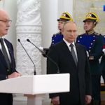 Putin stands to one side as he shakes uncontrollably ( Image: Russia-1)
