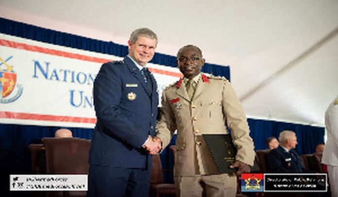Gen Michael T Plehn, President of NDU in a handshake with Col Isaac Amponsah Source: Ghana Armed Forces