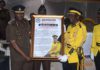 Director General of Prisons Mr. Isaac Kofi Egyir (left) presenting the citation to Nana Dr. Kofi Antwi II (right)